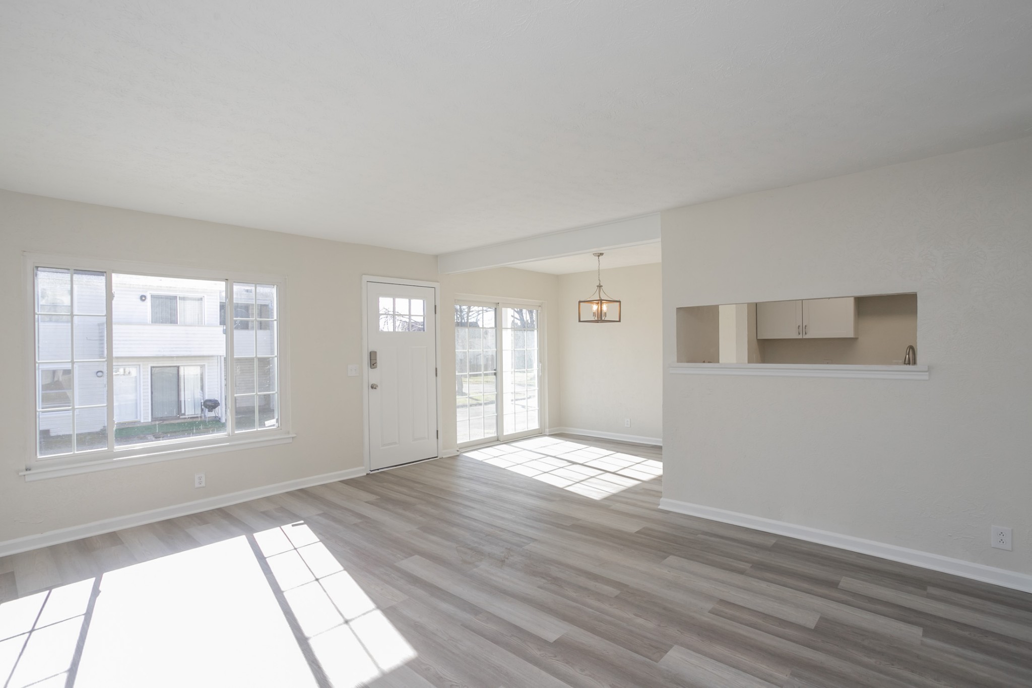 810 Bellevue Road, Unit 214 Nashville, TN 37221 - Photo 5 of 27 a view of an empty room with wooden floor and a window
