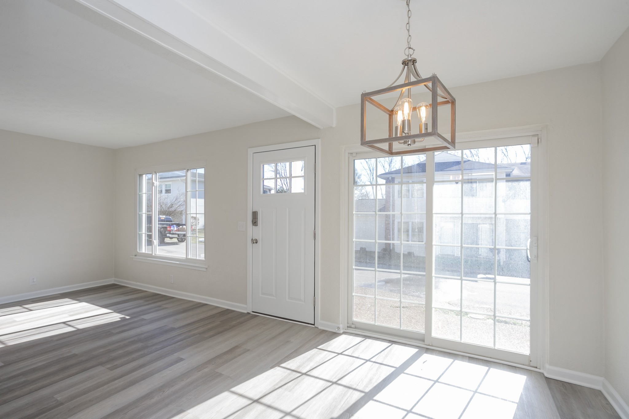 810 Bellevue Road, Unit 214 Nashville, TN 37221 - Photo 7 of 27 a view of an empty room with wooden floor and a window