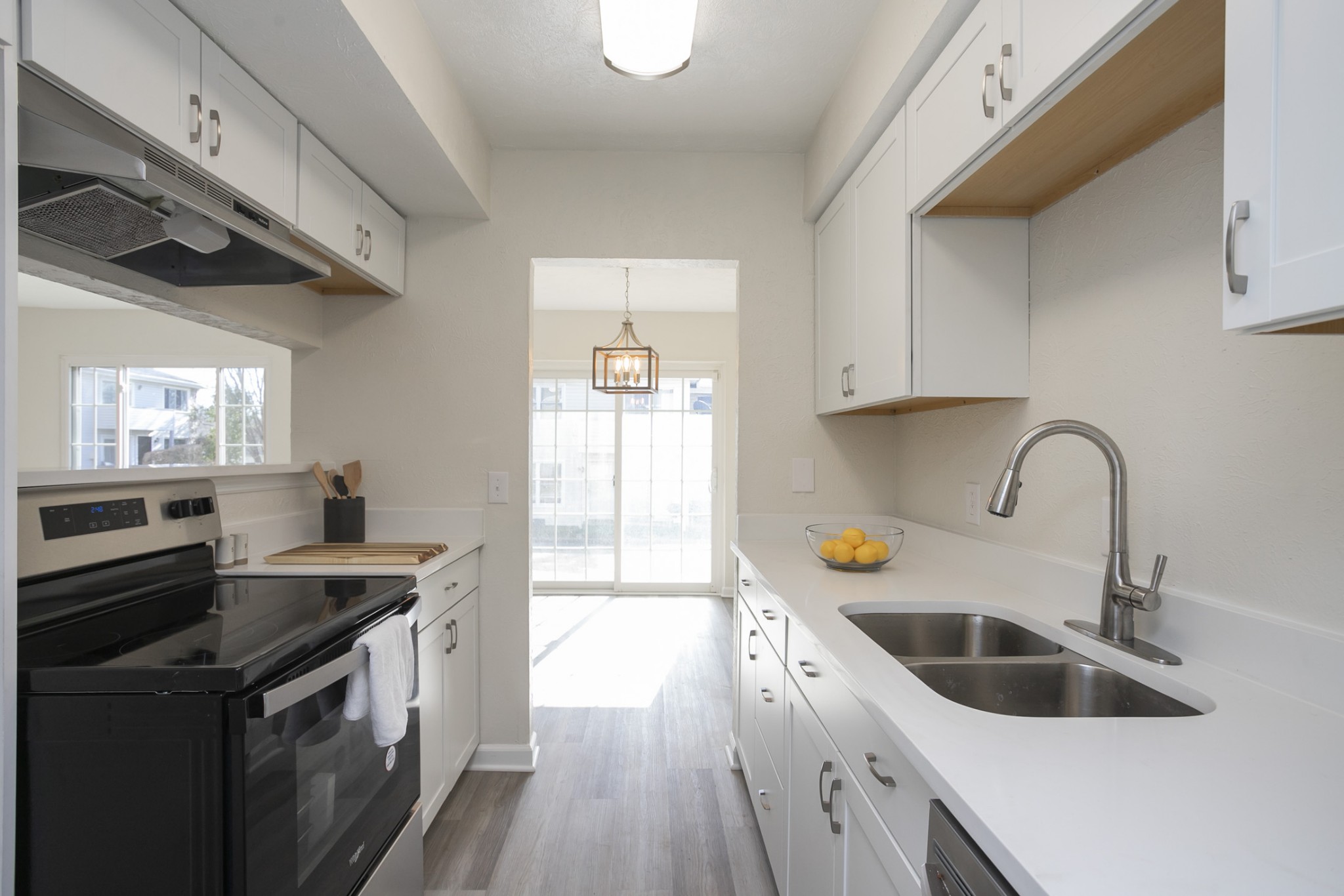 810 Bellevue Road, Unit 214 Nashville, TN 37221 - Photo 9 of 27 a kitchen with stainless steel appliances granite countertop a sink a stove and a wooden floors