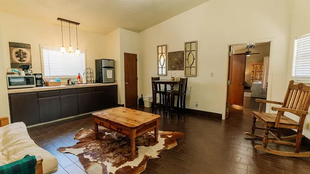 a living room with furniture and a table