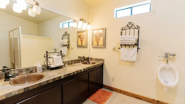 a bathroom with a sink and a mirror