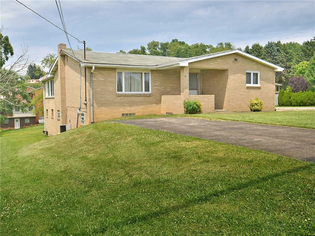 FRONT - LARGE CORNER LOT.  Xtra paved parking in the front to access the front door directly