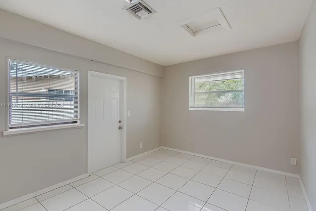 an empty room with windows