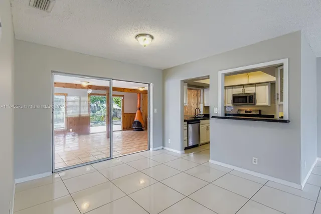 a view of a living room and entry way