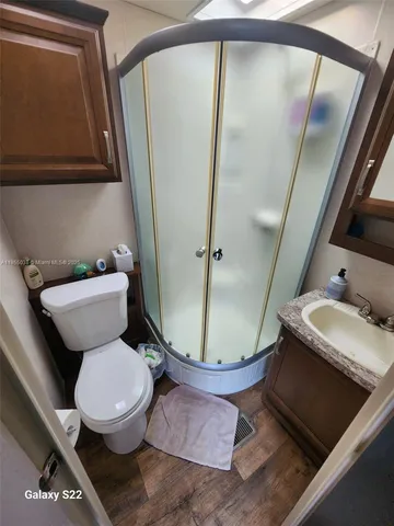 a bedroom with a bed and a mirror