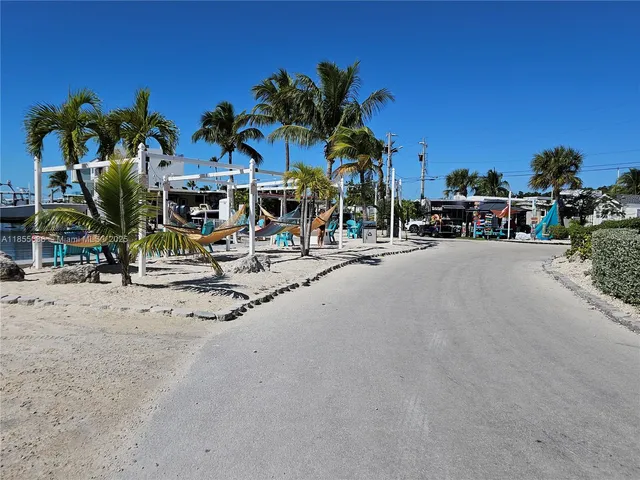 a view of a house with palm tree
