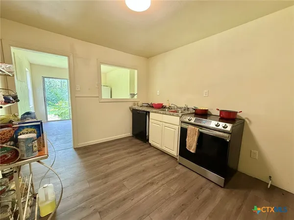 a kitchen with a stove and a microwave