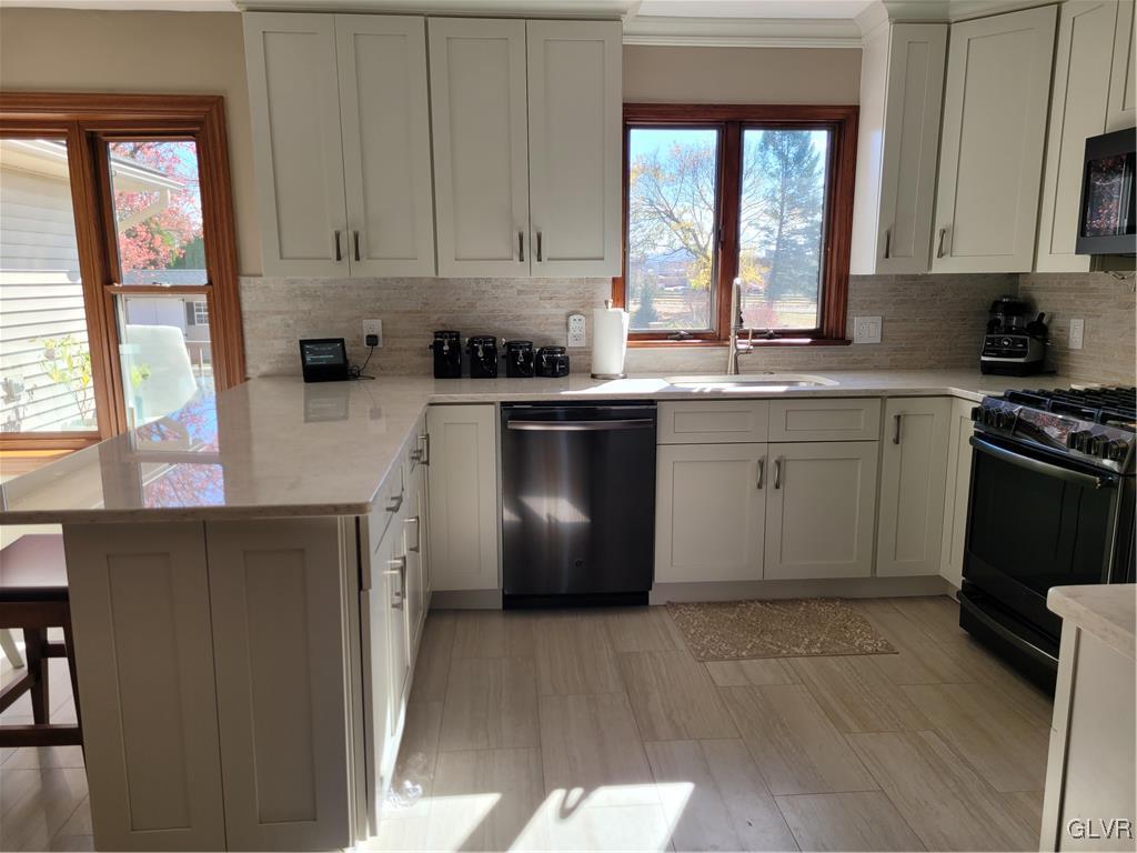 227 Ridgewood Road Easton, PA 18045 - Photo 13 of 49 a kitchen with a window a sink and a stove