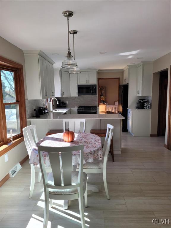 227 Ridgewood Road Easton, PA 18045 - Photo 15 of 49 a dining room with furniture a chandelier and window