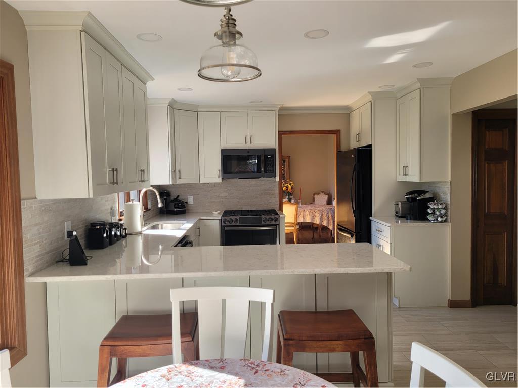 227 Ridgewood Road Easton, PA 18045 - Photo 17 of 49 a kitchen with a sink stove and refrigerator