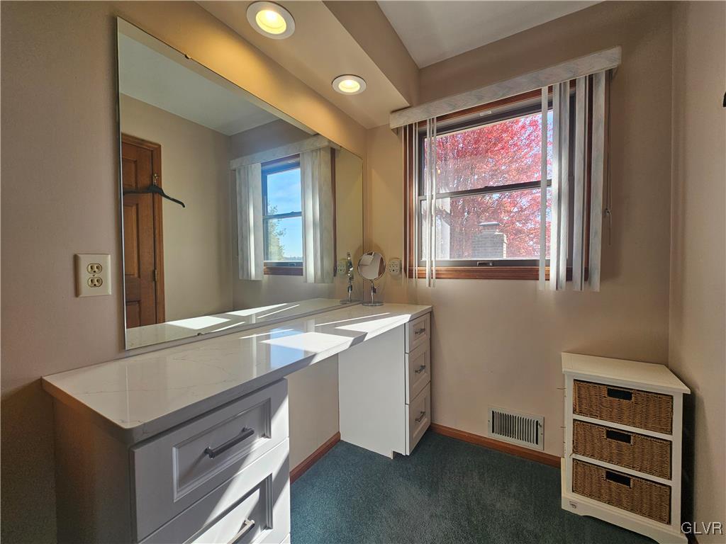 227 Ridgewood Road Easton, PA 18045 - Photo 27 of 49 a view of a kitchen island a sink wooden floor and a window