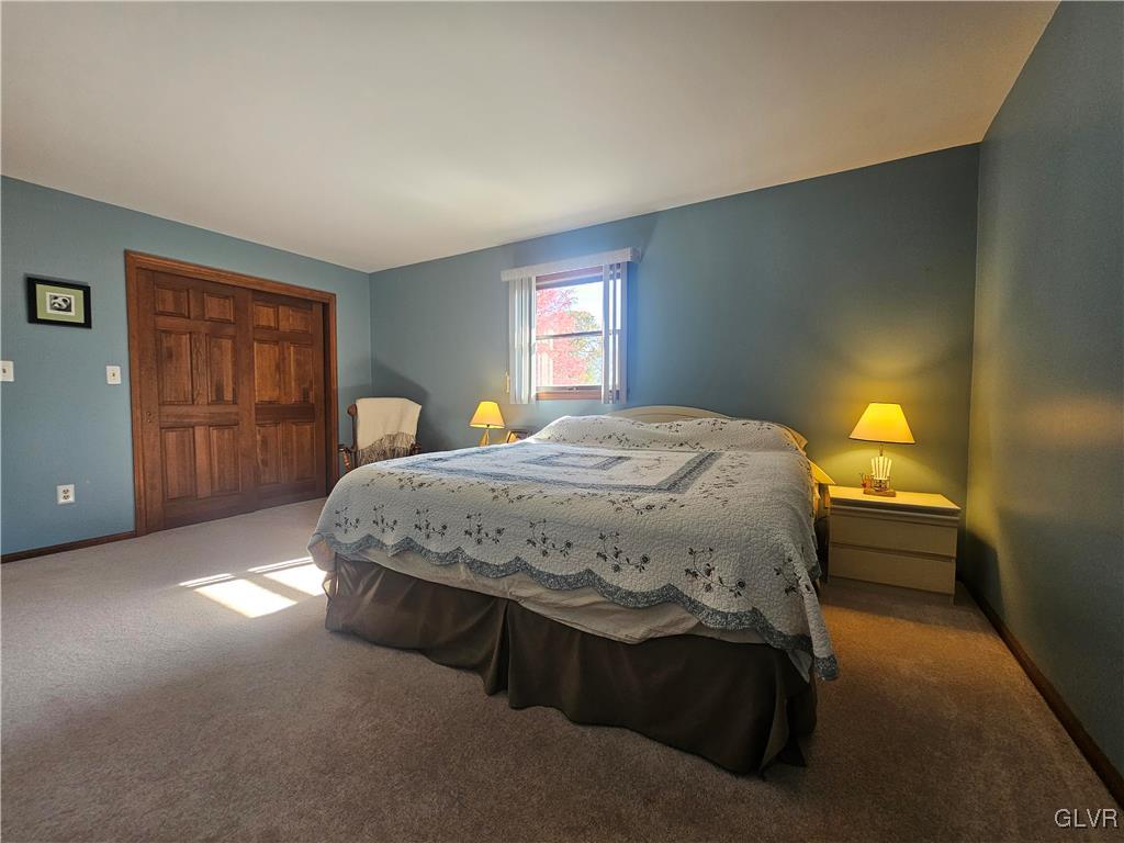 227 Ridgewood Road Easton, PA 18045 - Photo 30 of 49 a spacious bedroom with a bed and wooden floor
