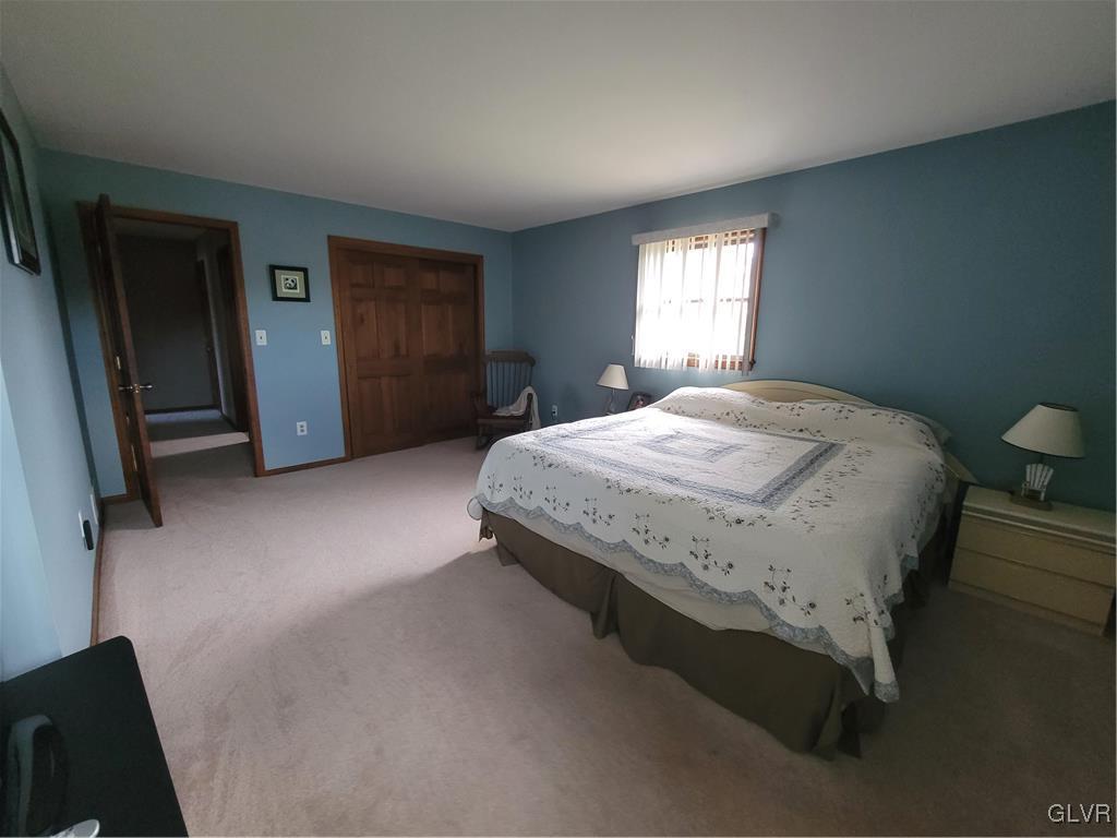 227 Ridgewood Road Easton, PA 18045 - Photo 32 of 49 a spacious bedroom with a bed and a window