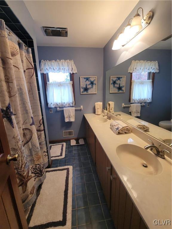 227 Ridgewood Road Easton, PA 18045 - Photo 35 of 49 a en suite bathroom with a double vanity sink and a mirror