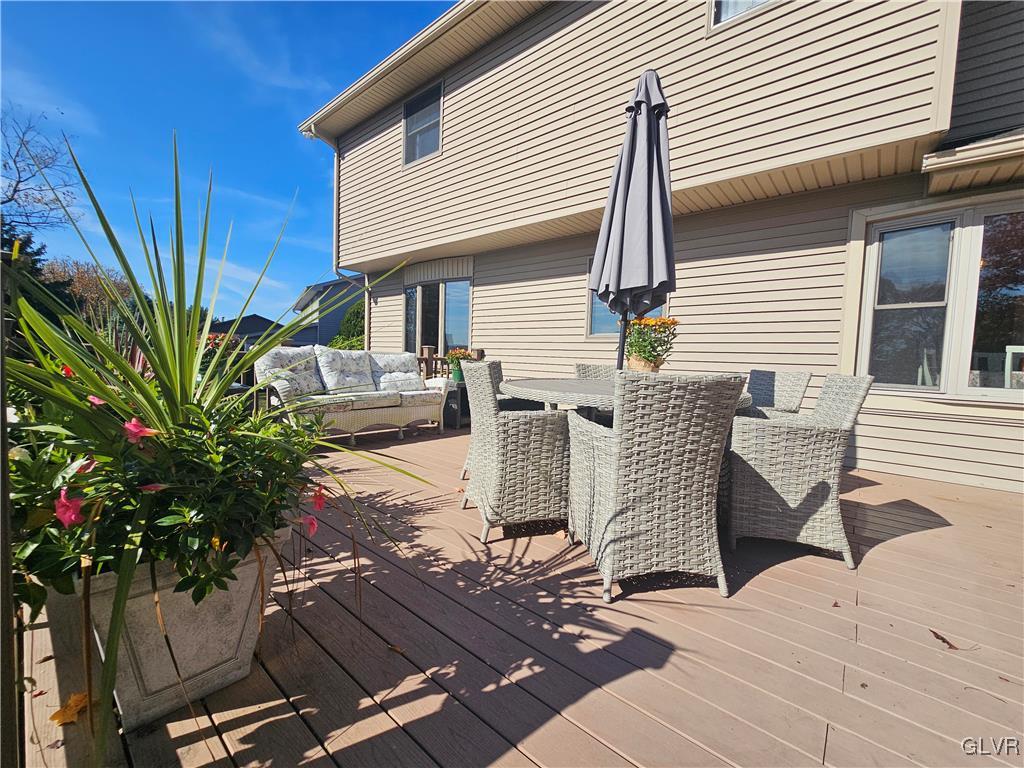 227 Ridgewood Road Easton, PA 18045 - Photo 42 of 49 a view of a patio with a table and chairs potted plants