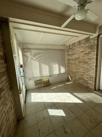 a view of a bathroom with a sink and shower