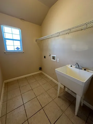 a bathroom with a sink and cabinets
