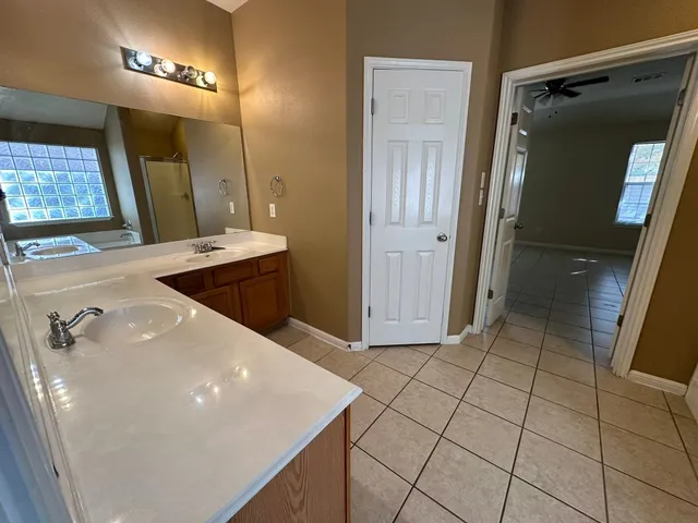 a bathroom with a sink a vanity and a mirror