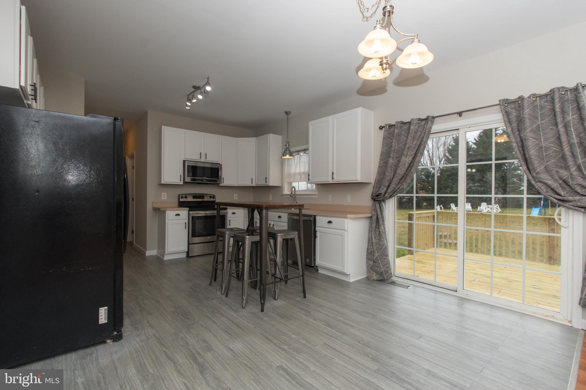 495 Harrington Road Rising Sun, MD 21911 - Photo 11 of 64 Kitchen w/ sliders to deck