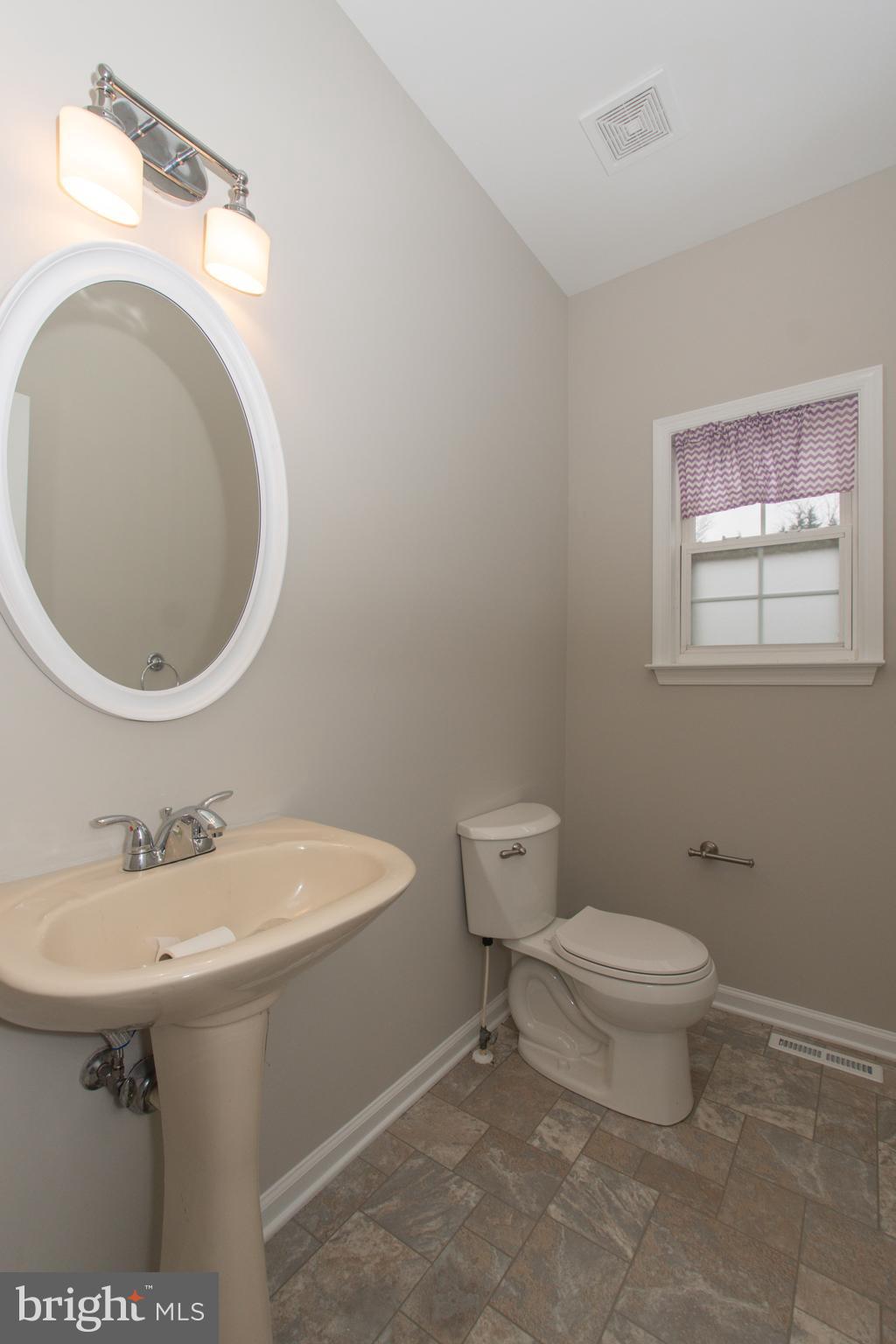 495 Harrington Road Rising Sun, MD 21911 - Photo 27 of 64 Powder Room w/new Toilet, light fixtures & mirror