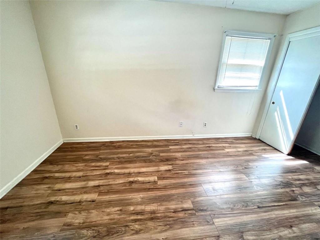 1002 Level Creek Road, Unit 201 Sugar Hill, GA 30518 - Photo 9 of 13 a view of empty room with wooden floor