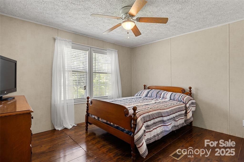 3478 Cool Branch Road Carlisle, SC 29031 - Photo 17 of 23 a bed sitting in a bedroom next to a window