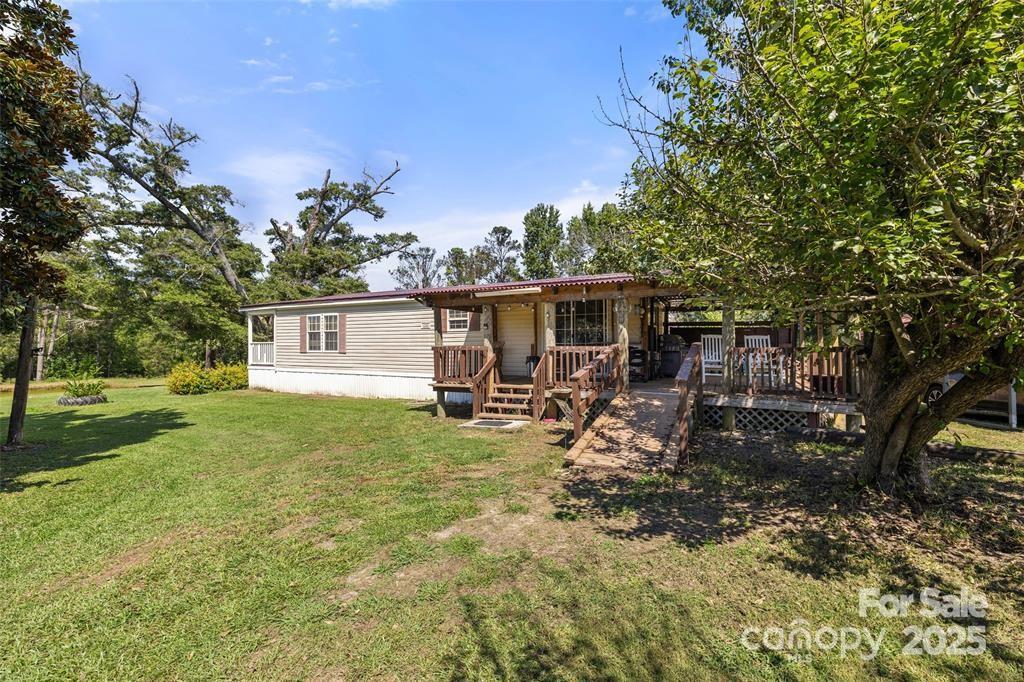 3478 Cool Branch Road Carlisle, SC 29031 - Photo 22 of 23 a view of a house with backyard and sitting area