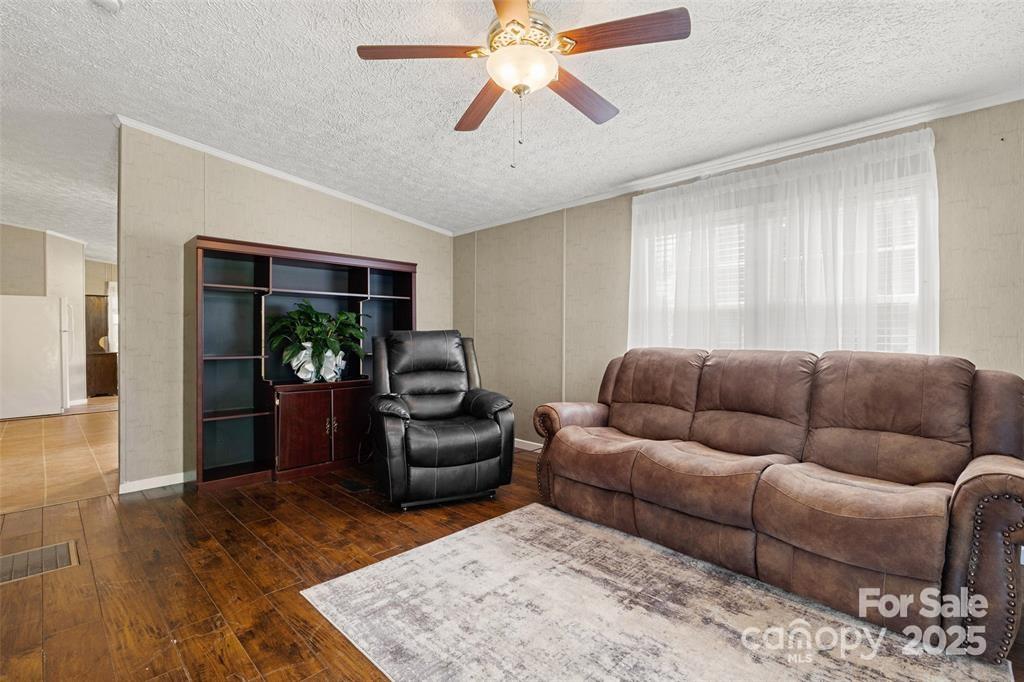 3478 Cool Branch Road Carlisle, SC 29031 - Photo 6 of 23 a living room with furniture and a wooden floor