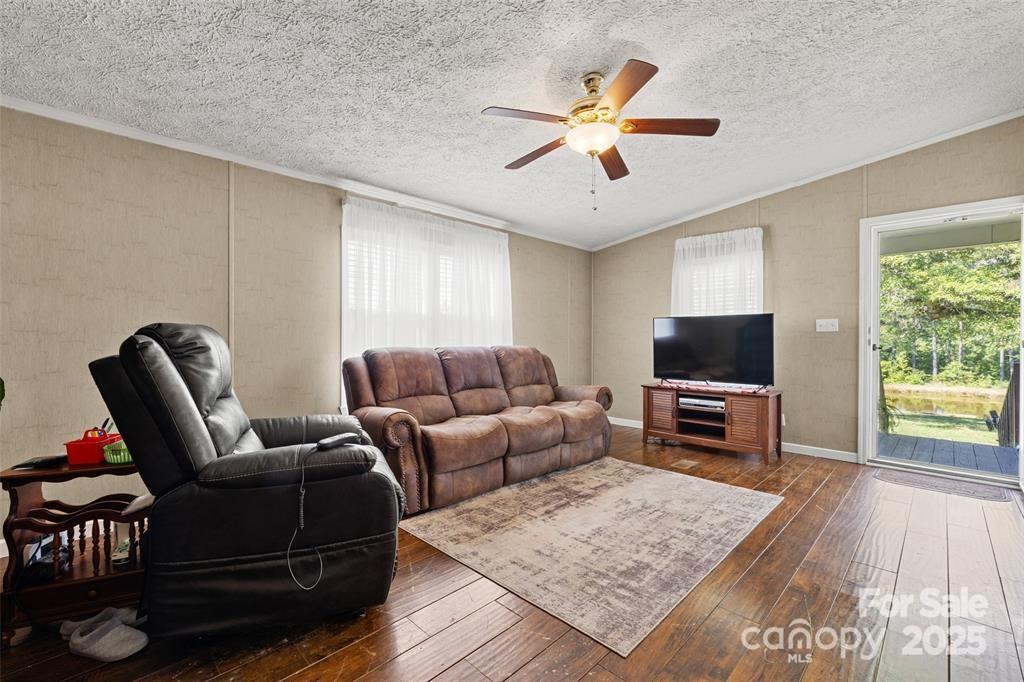 3478 Cool Branch Road Carlisle, SC 29031 - Photo 7 of 23 a living room with furniture and a flat screen tv