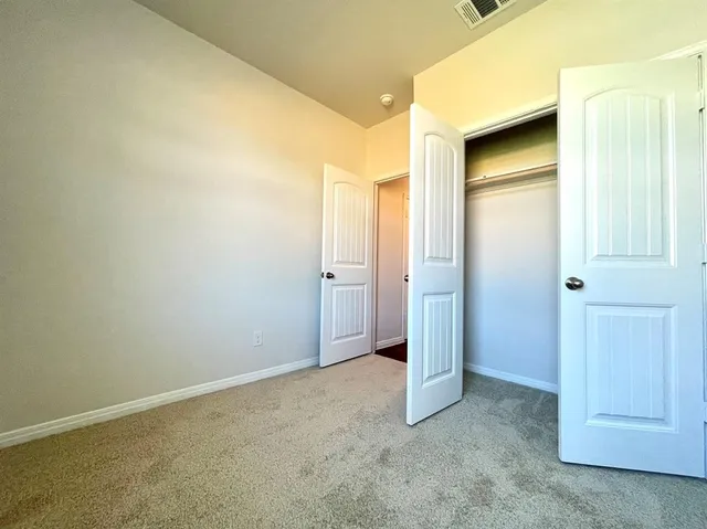 an empty room with a wooden door