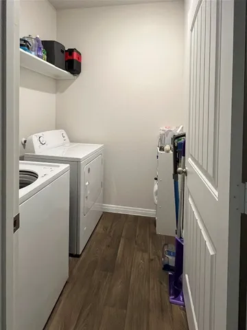 a view of storage and utility room with washer and dryer