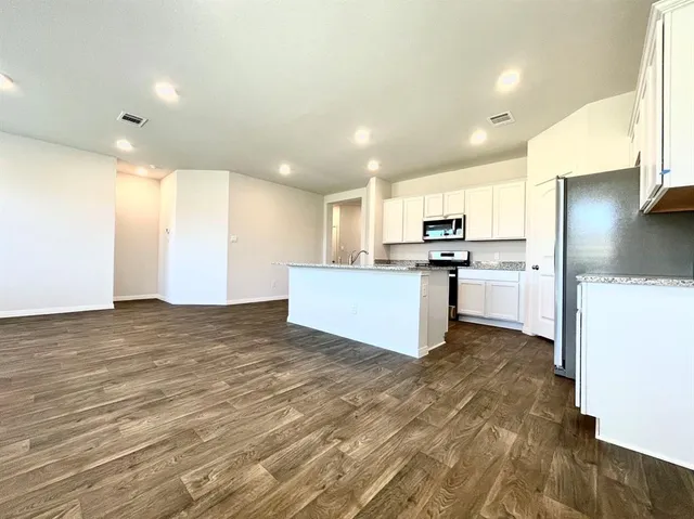 a view of kitchen with wooden floor