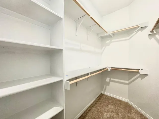 a view of an empty walk in closet