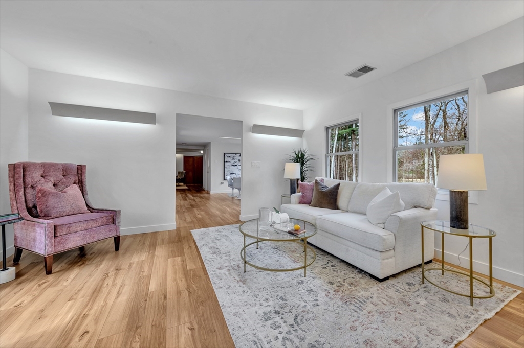 85 The Valley Road Concord, MA 01742 - Photo 35 of 38 a living room with furniture and wooden floor