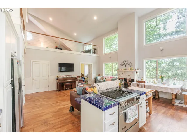 a living room with fireplace furniture and a flat screen tv