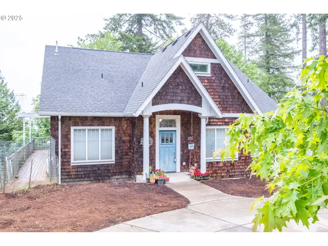 a front view of a house with garden