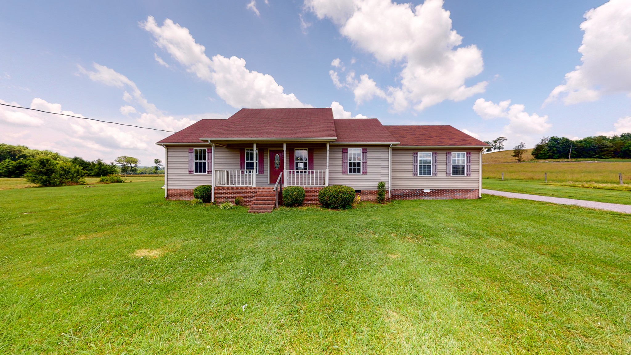 643 Beech Log Road Watertown, TN 37184 - Photo 1 of 31 a front view of a house with a garden