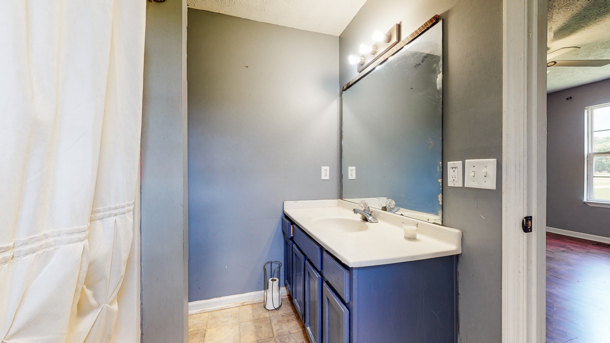 643 Beech Log Road Watertown, TN 37184 - Photo 12 of 31 a bathroom with a sink and a mirror
