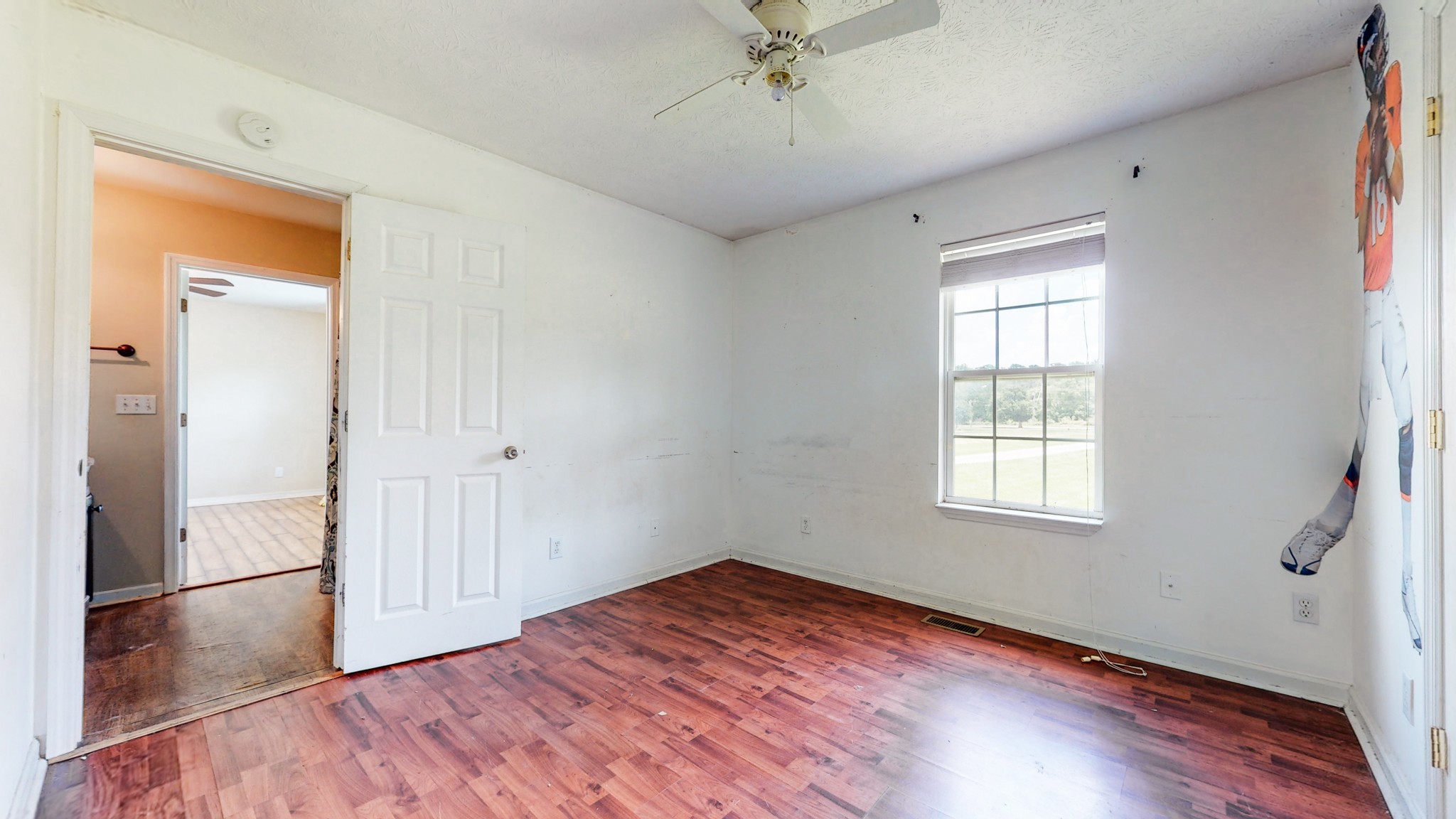 643 Beech Log Road Watertown, TN 37184 - Photo 16 of 31 wooden floor in an empty room with a window