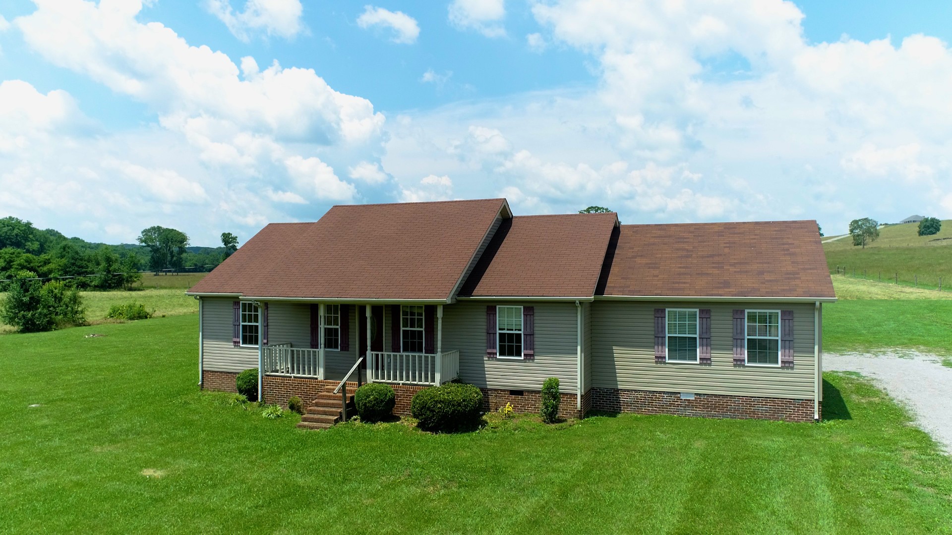 643 Beech Log Road Watertown, TN 37184 - Photo 3 of 31 a front view of a house with a yard table and chairs