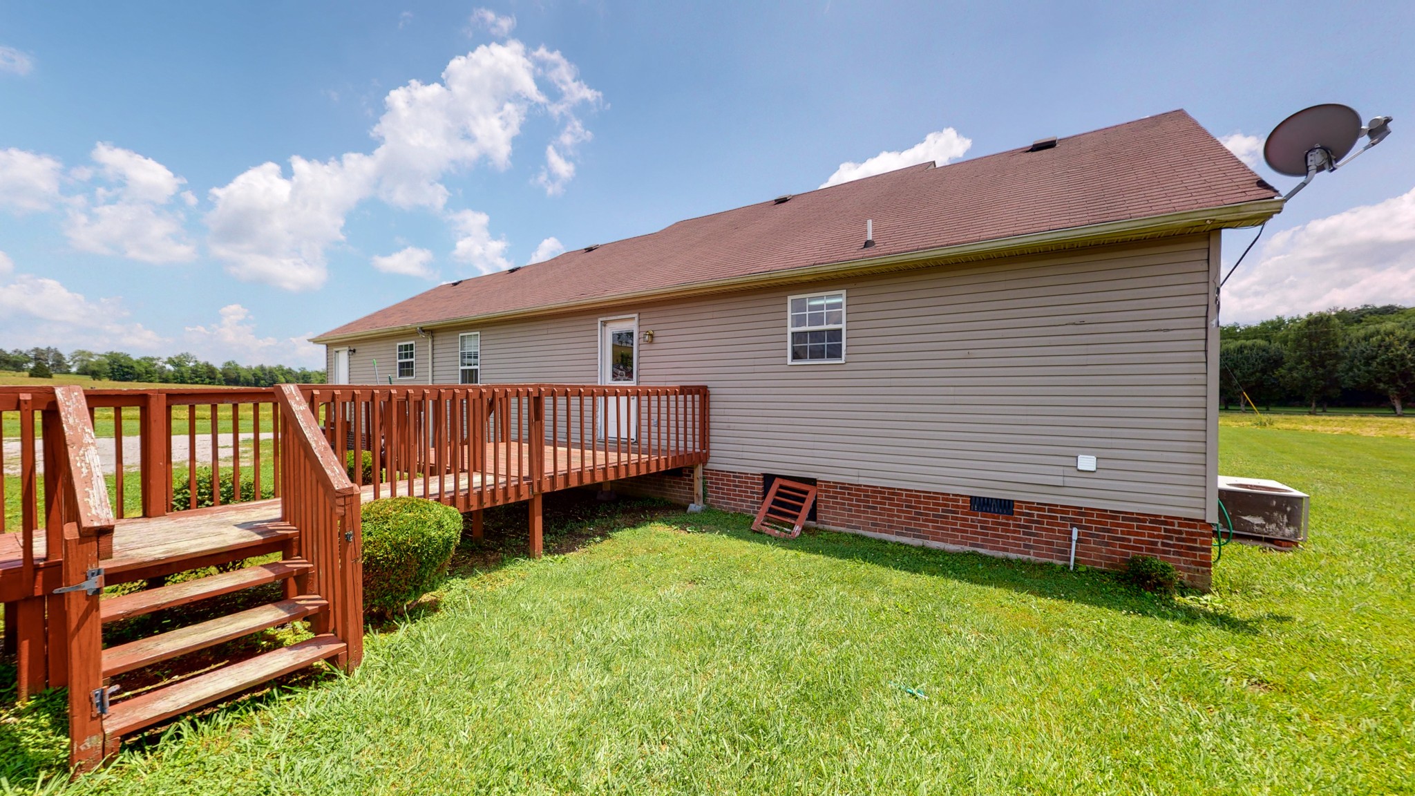 643 Beech Log Road Watertown, TN 37184 - Photo 24 of 31 a backyard of a house with barbeque oven and wooden fence