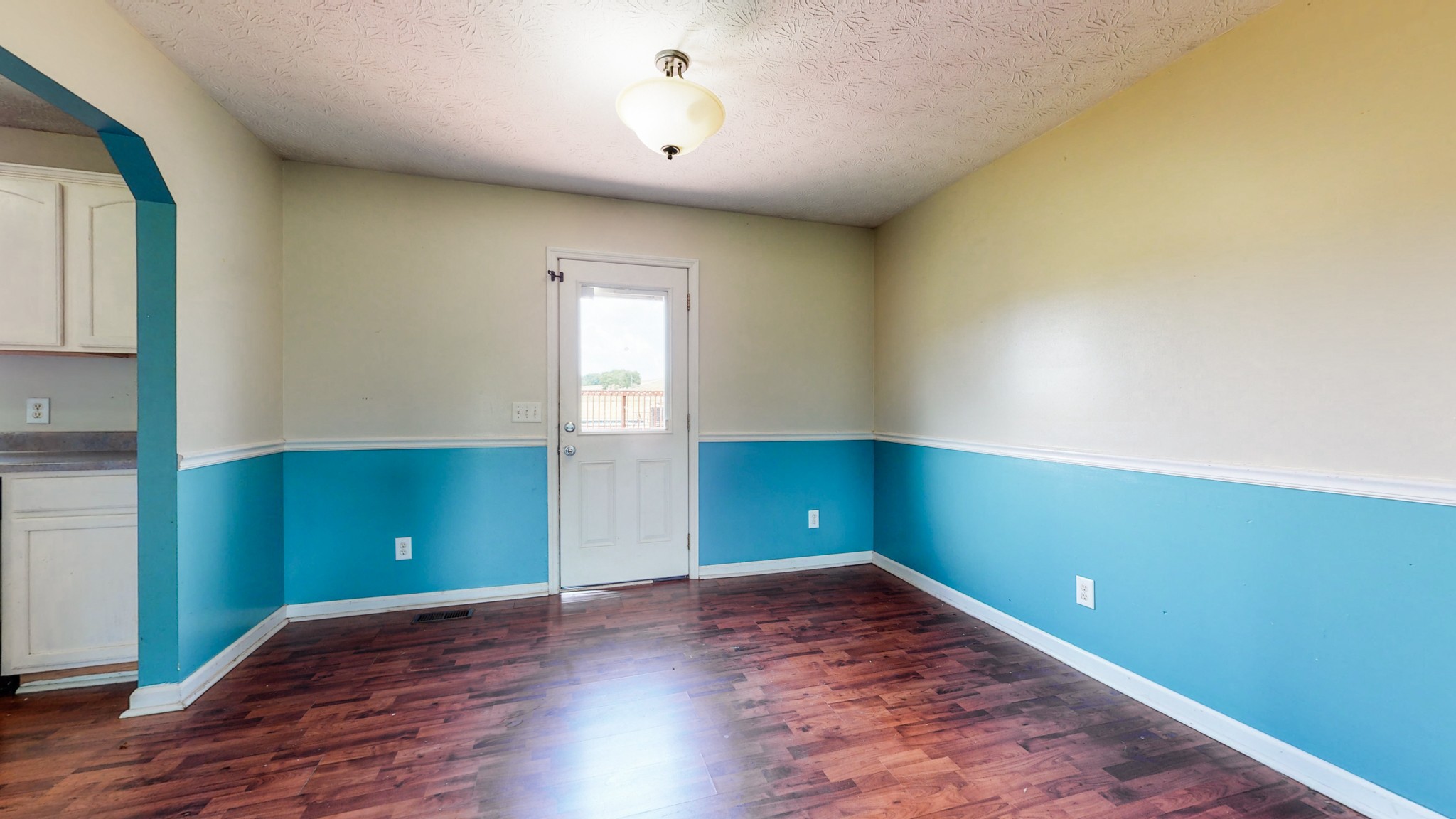 643 Beech Log Road Watertown, TN 37184 - Photo 8 of 31 an empty room with wooden floor and windows