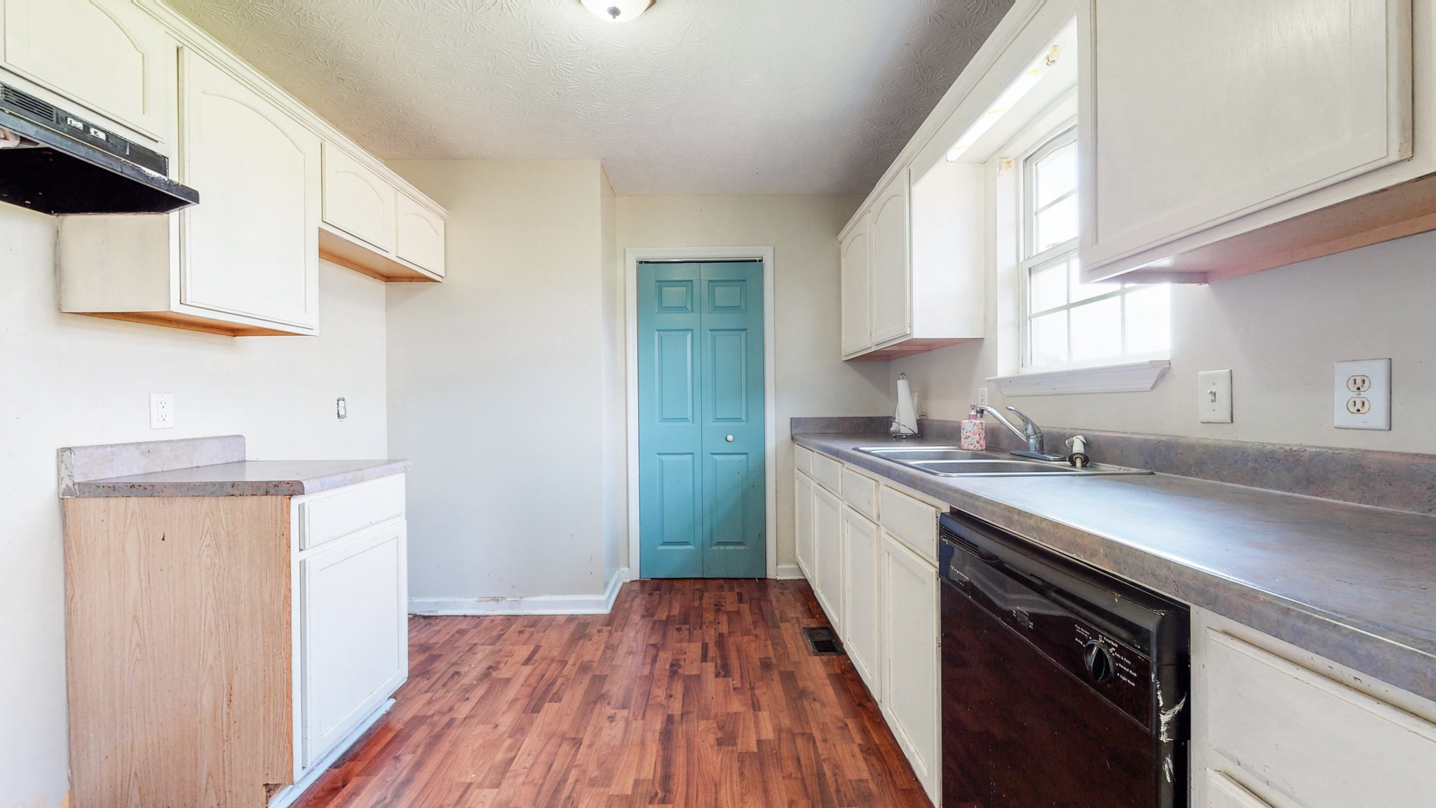 643 Beech Log Road Watertown, TN 37184 - Photo 9 of 31 a kitchen with a sink a window and cabinets