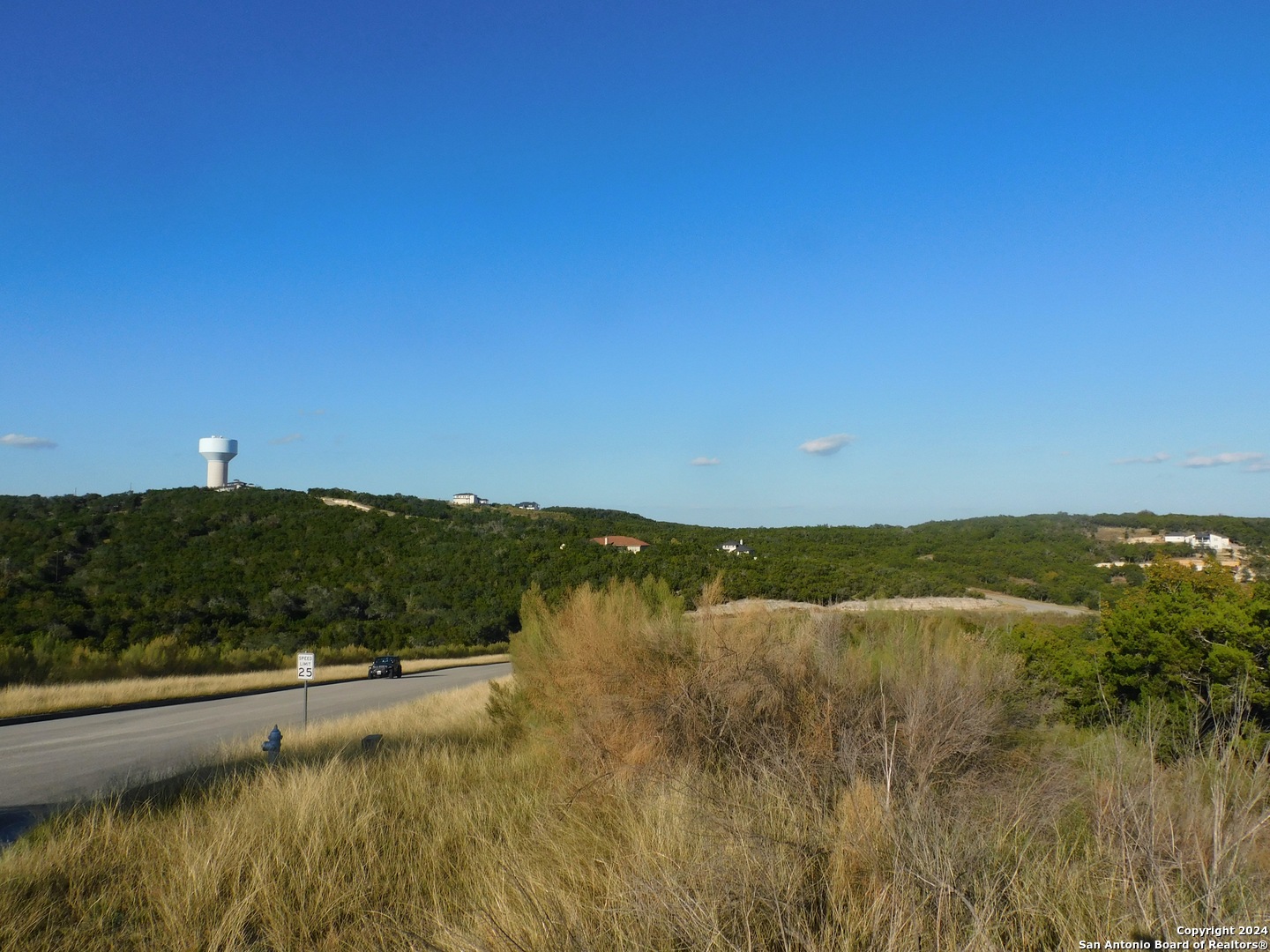 22202 Ravine San Antonio, TX 78255 - Photo 1 of 17 a view of lake and mountain