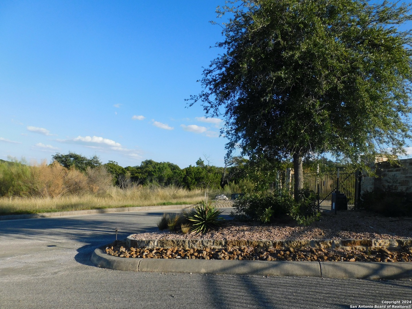 22202 Ravine San Antonio, TX 78255 - Photo 9 of 17 a view of a lake with a mountain