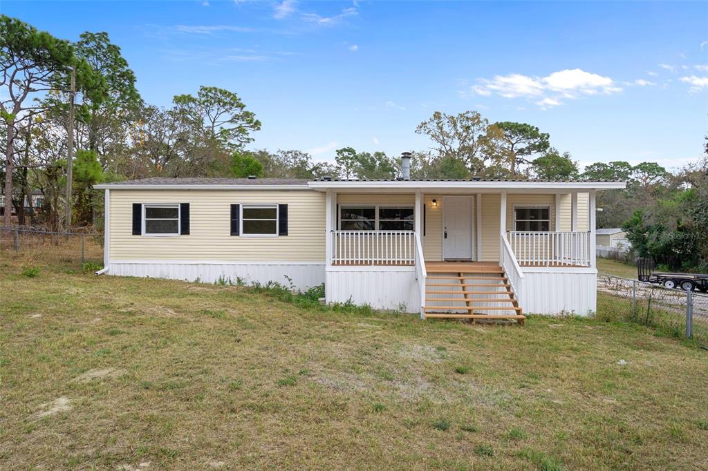 front view of a house with a yard