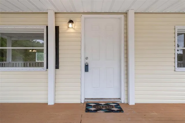 a bathroom with a shower and a glass door