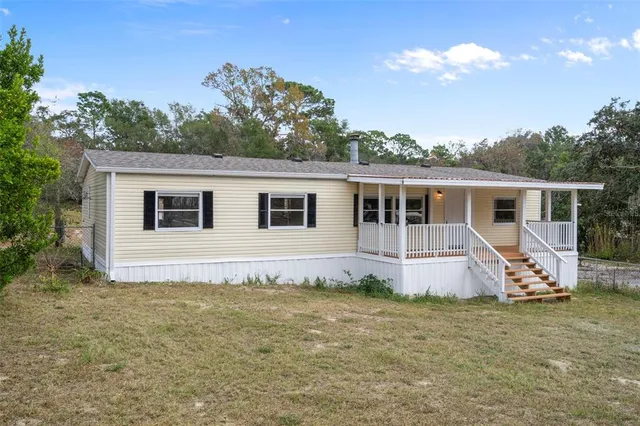 a view of a patio with a table chairs and a table