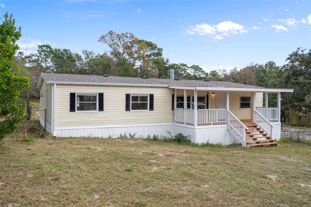 18008 Greensboro Street Spring Hill, FL 34610 - Photo 2 of 49 a view of a house with backyard