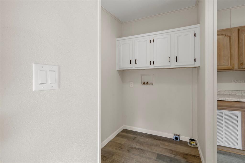 18008 Greensboro Street Spring Hill, FL 34610 - Photo 25 of 49 a view of kitchen with white cabinets